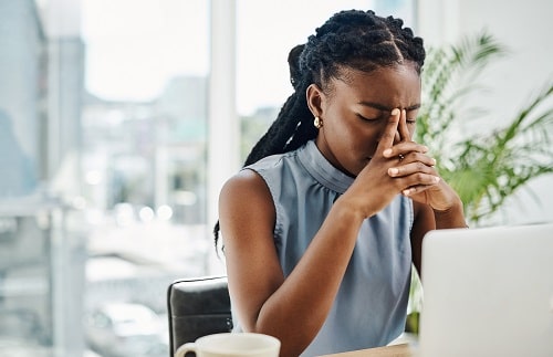 Stressed Out Female Office worker iStock Delmaine Donson